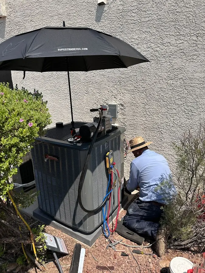 HVAC technician performing outdoor AC maintenance in Middle River